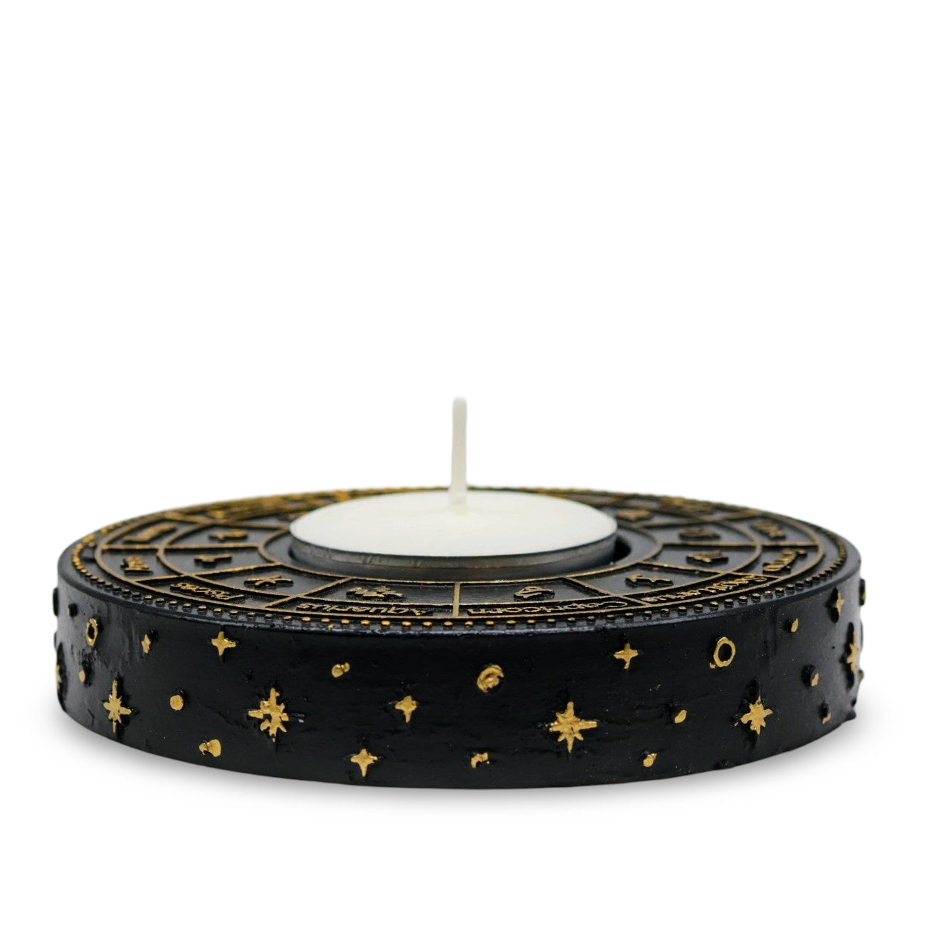 Astrology Wheel Zodiac tealight candle holder with intricate gold-effect design illuminating a celestial-themed space.